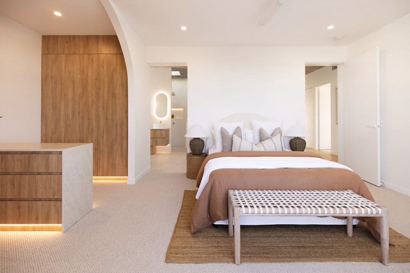 brown master bedroom bedding in a contemporary house, property styling by blink living